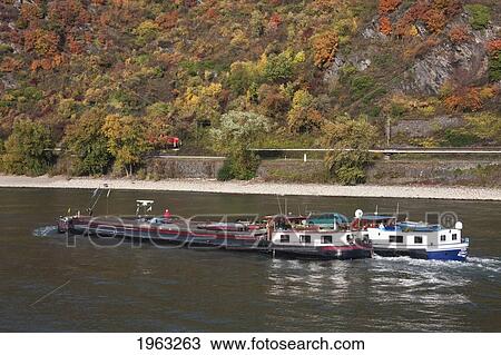 Cargo Ships On The Rhine River Near Bornhofen, Rhineland-Palatinate, Germany View Large Photo Image Stock Image - Cargo Ships On The Rhine River Near Bornhofen, Rhineland-Palatinate, Germany. Fotosearch