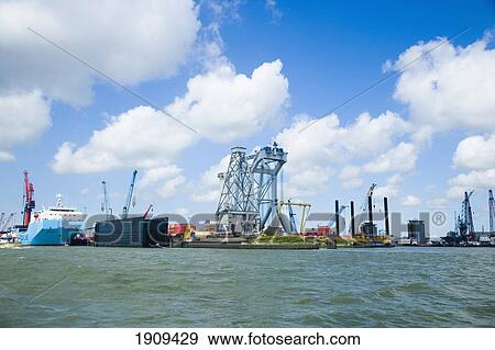 Cargo Vessels And Cranes, Port Of Rotterdam, Netherlands View Large Photo Image Stock Photo - Cargo Vessels And Cranes, Port Of Rotterdam, Netherlands. Fotosearch