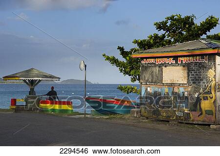 Stock Photograph - Caribbean, Grenada, Grenadines, Carriacou Island, Colorful painted stall; Hillsborough. Fotosearch