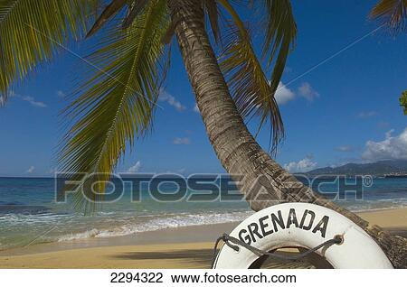 Stock Image - Caribbean, Grenada, Life buoy with Grenada written on it; Magazine Beach. Fotosearch