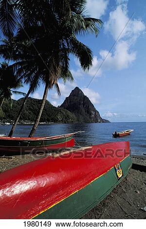 Stock Photo - Caribbean, Saint Lucia, Colorful Fishing Boats On Beach, Mountains In Background.. Fotosearch
