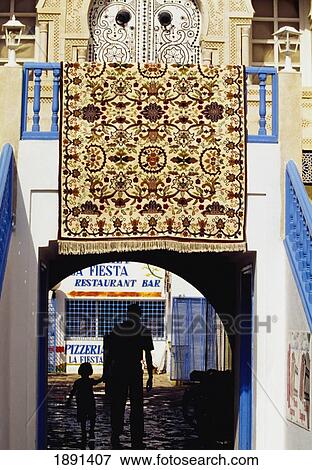 Stock Photo - Carpet Hanging On Balcony. Fotosearch