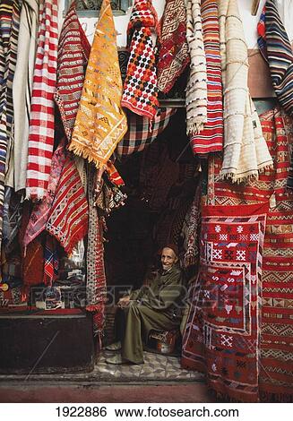 Stock Photograph - Carpet Shop Owner In Souks. Fotosearch