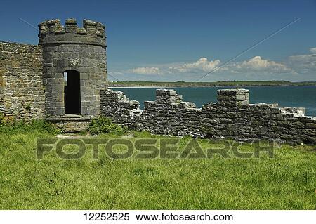 Stock Photography - Carrigaholt Castle on the Wild Atlantic Way coastal route; County Clare, Ireland. Fotosearch