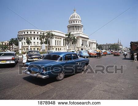 Cars In Street Outside Capital Building View Large Photo Image Stock Photo - Cars In Street Outside Capital Building. Fotosearch