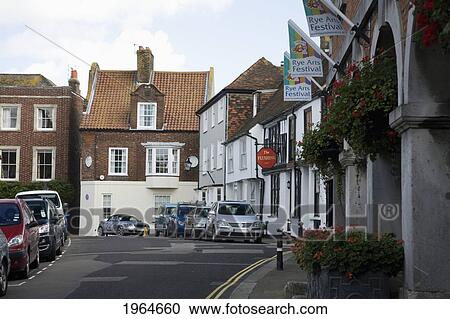 Stock Image - Cars Parked Along The Side Of The Street In An Urban Area; Rye Sussex England. Fotosearch