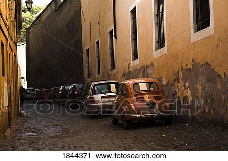 Stock Image - Cars Parked In Row; Rome, Italy. Fotosearch