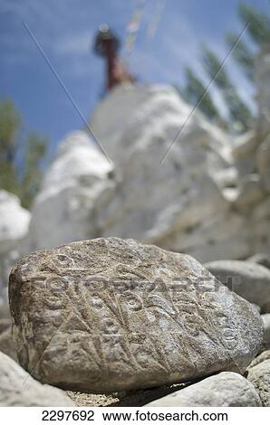 Carved mane stone in front of the Gomang Stupa in Changspa, Leh. Leh was the capital of the Himalayan kingdom of Ladakh, now the Leh District in the state of Jammu and Kashmir, India. Leh is at an altitude of 3, 500 meters (11, 483 ft). View Large Photo Image Stock Image - Carved mane stone in front of the Gomang Stupa in Changspa, Leh. Leh was the capital of the Himalayan kingdom of Ladakh, now the Leh District in the state of Jammu and Kashmir, India. Leh is at an altitude of 3, 500 meters (11, 483 ft).. Fotosearch