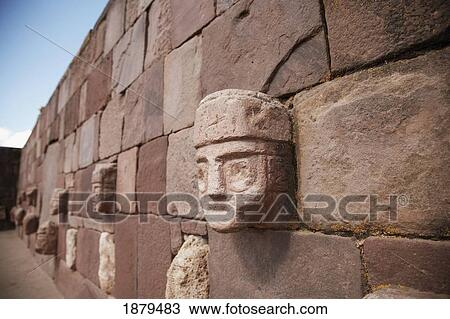 Stock Image - Carved Stone Heads In Ruins. Fotosearch