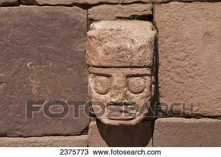 Carved stone tenon-head embedded in the wall of the Semi-subterranean Temple, Tiwanaku, La Paz Department, Bolivia View Large Photo Image Stock Image - Carved stone tenon-head embedded in the wall of the Semi-subterranean Temple, Tiwanaku, La Paz Department, Bolivia. Fotosearch