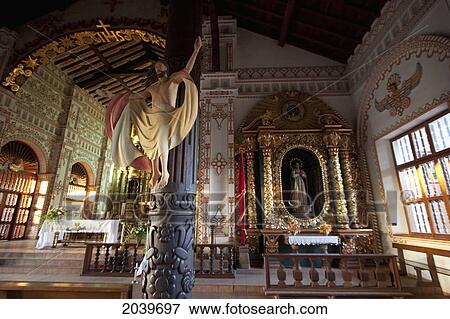 Stock Photo - Carved Wooden Image Of Christ, The Redeemer In The Mestizo-Baroque Style On A Column Of The Jesuit Mission Of San Ignacio De Velasco, Santa Cruz Department, Bolivia. Fotosearch
