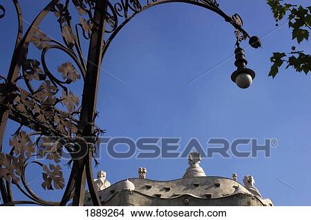Picture - Casa Mila And Ornate Lamp Post, Low Angle View. Fotosearch