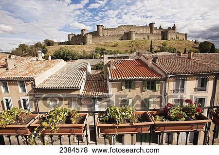 Stock Photo - Castle and ramparts viewed from the balcony of a bed and breakfast accommodation; Carcassonne, Languedoc-Rousillion, France. Fotosearch