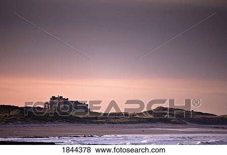 Castle At Dusk; Northumberland, England, Uk View Large Photo Image Stock Photo - Castle At Dusk; Northumberland, England, Uk. Fotosearch