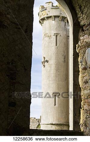 Stock Photograph - Castle turret framed in large window of stone wall; Clifden, County Galway, Ireland. Fotosearch