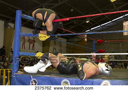 Stock Image - Catch wrestlers in combat at the Cholitas Wrestling Event, El Alto, La Paz, Bolivia. Fotosearch