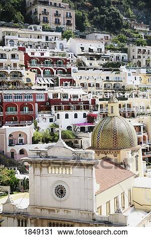 Stock Image - Cathedral Of Our Lady Of The Assumption, Positano, Amalfi Coast, Italy; Coastal Buildings And Church. Fotosearch