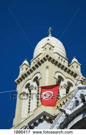 Stock Photo - Cathedral Of St Vincent De Paul And Tunisian Flag. Fotosearch