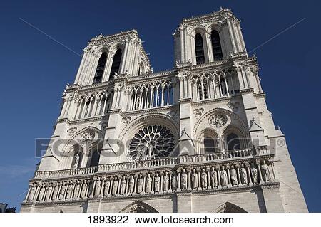 Stock Image - Cathedral Towers And Facade With A Blue Sky Background; Paris, France. Fotosearch