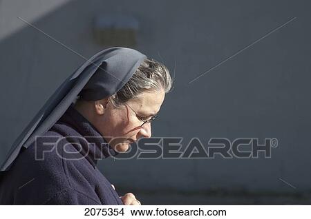 Picture - Catholic Nun, Vilnius, Lithuania. Fotosearch