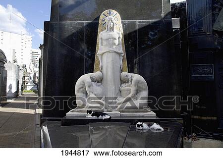 Stock Photo - Cats sleeping on an Art Deco tomb at the Cementerio de la Recoleta, Buenos Aires, Capital Federal, Argentina. Fotosearch