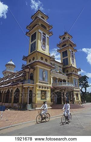 Stock Photo - Cau Dai Temple And Cyclists. Fotosearch