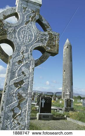 Stock Photo - Celtic Cross And Round Tower, Close Up. Fotosearch