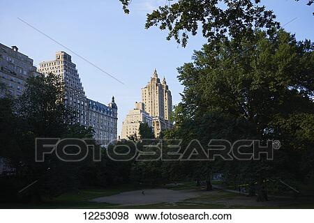 Stock Photo - Central Park at sunset looking towards Upper West Side of Manhattan; New York City, New York, United States of America. Fotosearch