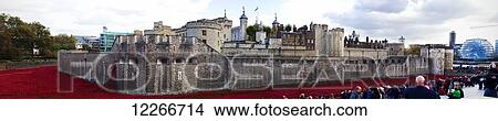 Picture - Ceramic poppies at the Tower of London's moat to mark the one hundred anniversary of the first world war; London, England. Fotosearch
