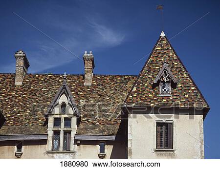 Stock Image - Ceramic Tiled Roof Of Chateau Marguerite Bourgogne. Fotosearch
