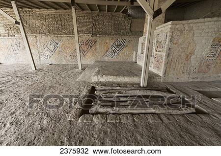 Stock Image - Ceremonial precinct decorated with polychrome Moche friezes where the Royal Tomb of the Lady of Cao and her escorts was found at Huaca Cao Viejo (or Huaca Blanca) at El Brujo Archaeological Complex, La Libertad, Peru. Fotosearch