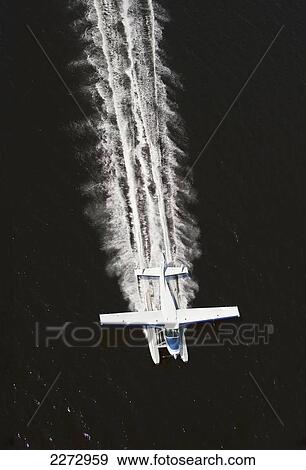 Cessna amphibian seaplane leaving a wake across the water; british columbia canada View Large Photo Image Stock Photo - Cessna amphibian seaplane leaving a wake across the water; british columbia canada. Fotosearch
