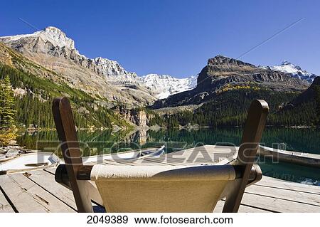 Stock Photo - Chair On A Dock, Lake O'hara And Mountains, Yoho National Park, British Columbia. Fotosearch