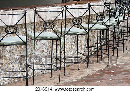 Chairs Lined Up At An Outdoor Bar; Sayulita Mexico View Large Photo Image Picture - Chairs Lined Up At An Outdoor Bar; Sayulita Mexico. Fotosearch