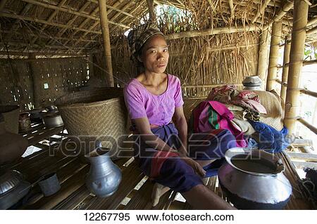 Chakma woman sitting in her house; Khagrachari, Chittagong Division, Bangladesh View Large Photo Image Stock Photography - Chakma woman sitting in her house; Khagrachari, Chittagong Division, Bangladesh. Fotosearch
