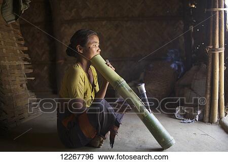 Chakma woman smoking tobacco; Khagrachari, Chittagong Division, Bangladesh View Large Photo Image Stock Photograph - Chakma woman smoking tobacco; Khagrachari, Chittagong Division, Bangladesh. Fotosearch