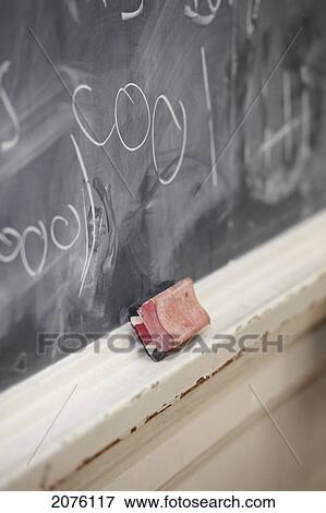 Stock Photo - Chalkboard Eraser And Blackboard In A Classroom. Fotosearch