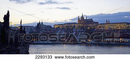 Stock Image - Chalres Bridge, River Vltava and Castle District (Hradcany) at dusk, Prague, Czech Republic, Europe. Fotosearch