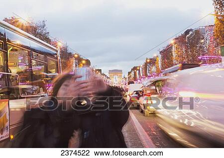 Stock Image - Champs Elysees and Arc de Triomphe at dusk; Paris, France. Fotosearch