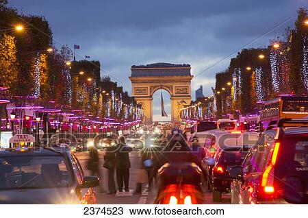 Stock Image - Champs Elysees and Arc de Triomphe at dusk; Paris, France. Fotosearch