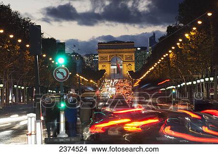 Picture - Champs Elysees and Arc de Triomphe decorated for Christmas at dusk; Paris, France. Fotosearch