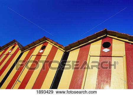 Stock Photo - Changing Cabins On Beach, Low Angle View. Fotosearch
