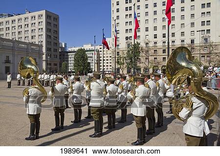 Stock Image - Changing of the guards by Carabineros on Plaza de la Constitucion in front of the Palacio de la Moneda Presidential Palace, Santiago, Metropolitan Region, Chile. Fotosearch
