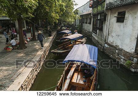 Channels the boatmen drive their boats as Venetia; ZhouZhuang, Shanghai, China View Large Photo Image Stock Photography - Channels the boatmen drive their boats as Venetia; ZhouZhuang, Shanghai, China. Fotosearch