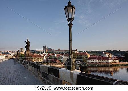 Charles Bridge With The Prague Castle In The Background At Sunrise, Prague, Czech Republic View Large Photo Image Stock Image - Charles Bridge With The Prague Castle In The Background At Sunrise, Prague, Czech Republic. Fotosearch