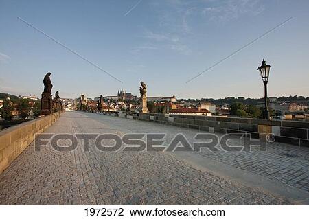 Stock Image - Charles Bridge With The Prague Castle In The Background At Sunrise, Prague, Czech Republic. Fotosearch