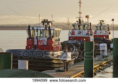 Stock Photo - Charles H. Cates Tugboats In Burrard Inlet At Sunset, North Vancouver, British Columbia, Canada. Fotosearch