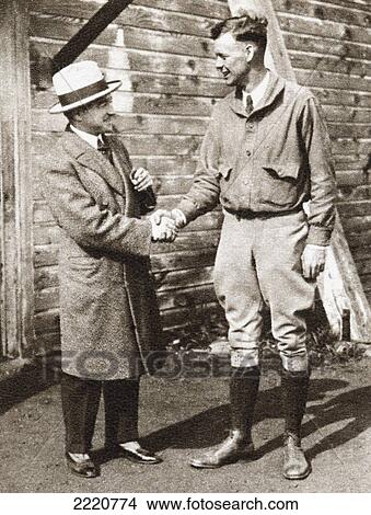 Charles Lindbergh (Right) Being Welcomed On His Arrival In Paris In 1927 By French Aviator Rene Fonck. Charles Augustus Lindbergh, 1902 View Large Photo Image Picture - Charles Lindbergh (Right) Being Welcomed On His Arrival In Paris In 1927 By French Aviator Rene Fonck. Charles Augustus Lindbergh, 1902. Fotosearch