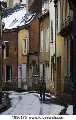Chartres, France; Person Walking Down Narrow Town Street In Winter View Large Photo Image Stock Photography - Chartres, France; Person Walking Down Narrow Town Street In Winter. Fotosearch