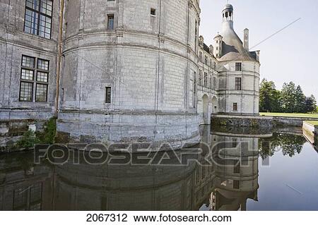 Stock Image - Chateau De Chambord Reflected In The Moat, France. Fotosearch